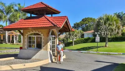 a man standing in front of a small building at Villa Collie Luxury Retreat7 King Master BRMaid in Sosúa