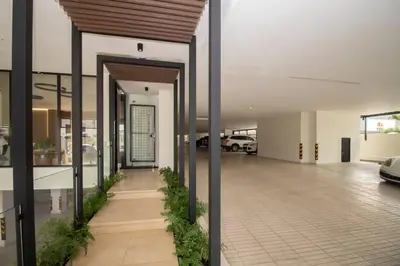 an empty parking lot with cars in a garage at Brand New Luxury Home in Santo Domingo