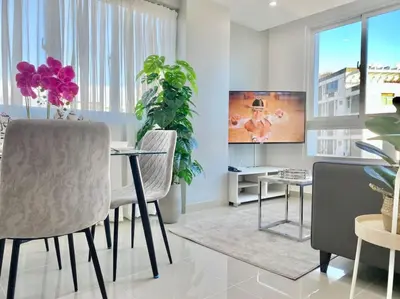 a living room with a table and chairs at Cozy City Center Condo Full AC in Santo Domingo