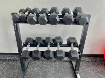 a rack of dumbbells sitting on the floor at Lovely City Center Condo in Los Prados