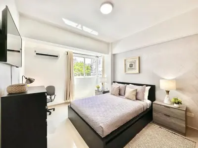 a bedroom with a bed and a window at Beautiful Condo in Bella Vista in Los Prados