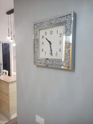 a clock on a wall in a room at Elegant and confortable close to Boca Chica Beach in Boca Chica