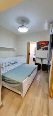 a bedroom with a large bed in a room at Apartaestudio en el centro de Puerto Plata in San Felipe de Puerto Plata