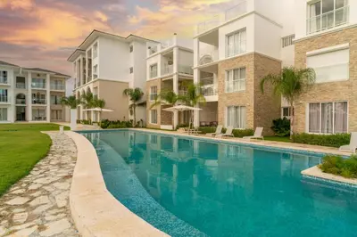 an image of a swimming pool at a apartment complex at Hard Rock at Cana Pearl 1 by Unwind Properties in Punta Cana
