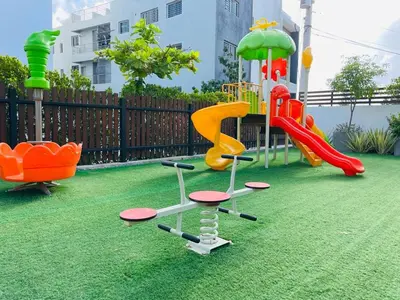 a playground with a slide and a slidesktop at Rustic Elegance St in Santiago de los Caballeros