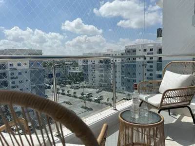 a balcony with a view of a city at Rustic Elegance St in Santiago de los Caballeros