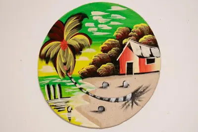 a plate with a painting of a house on a beach at Villa Caribe in Bayahibe