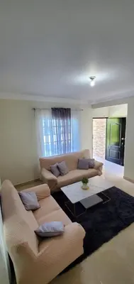 a living room with a couch and a table at Pine Tree Entire House 2B Gated Com in Higuey