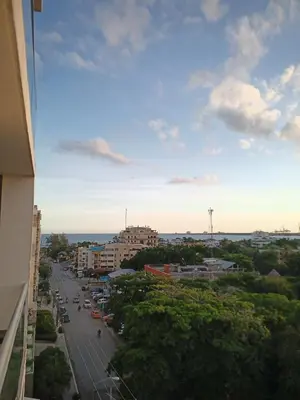 a view of a city with a street and buildings at Confortable apto. en Boca Chica in Boca Chica