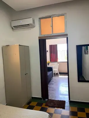 a room with a door open to a living room at APARTAMENTO ZONA COLONIAL R in Santo Domingo