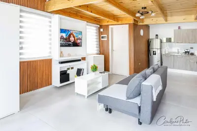 a living room with a couch and a tv at Paradise Dream Dominicus in La Laguna