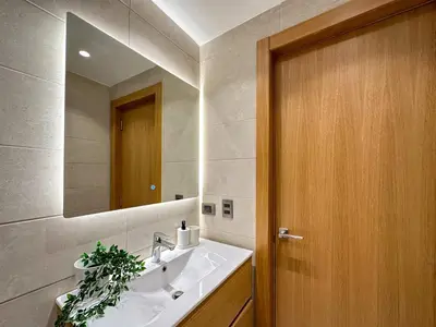 a bathroom with a sink and a mirror at Fantastic Penthouse at Golf Course in Punta Cana
