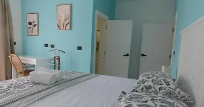a bedroom with a bed and a desk in a room at All Seasons Hotel in Bayahibe