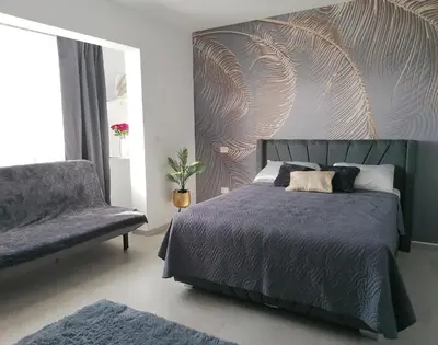 a bedroom with a bed and a chair at Star of Caribbean- Estrella Dominicus Bayahibe in Bayahibe