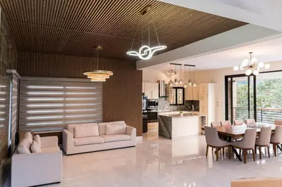 a living room with a couch and a table at Luxury Mountain villa, Jarabacoa villa vargas in Concepción de La Vega