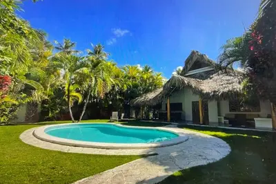 a swimming pool in front of a house at Las Terrenas Villa- King Bed, Beaches & Dining in Las Terrenas
