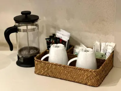 a basket with cups and a blender on a counter at Las Terrenas Villa- King Bed, Beaches & Dining in Las Terrenas