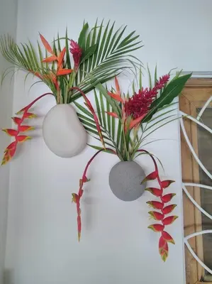 two plants in white vases on a wall at Las Terrenas Villa- King Bed, Beaches & Dining in Las Terrenas