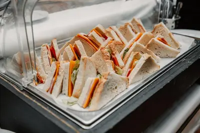 a group of sandwiches on a tray on a counter at Hotel Plaza Brisas in Punta Cana