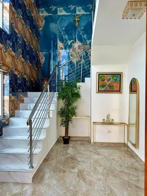 a staircase in a house with a blue ceiling at Villa Selina in Punta Cana