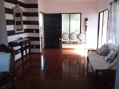 a living room with black and white striped walls and a couch at The Beauty of samana in Santa Bárbara de Samaná