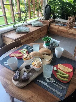 a table with a tray of food on top of it at Casa Shambala B&B in Las Terrenas