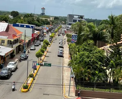 a city street with cars driving down a street at Plataview Apartahotel apt 3C in Monte Plata