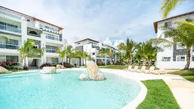 a swimming pool with a fountain in a resort at Estrella Dominicus Ekskluzywny Apartament ,,Bajeczny Widok,, in La Laguna