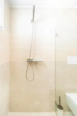 a bathroom with a shower with a glass door at Estrella Dominicus Ekskluzywny Apartament ,,Bajeczny Widok,, in La Laguna