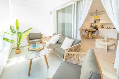 a living room with a couch and a table at Estrella Dominicus Ekskluzywny Apartament ,,Bajeczny Widok,, in La Laguna