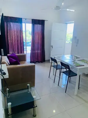 a living room with a couch and a table at Plataview Apartahotel apt 4A in Monte Plata