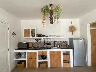 a kitchen with a sink and a refrigerator at Portitxol, fantástico apartamento in Bayahibe