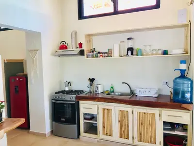a kitchen with a sink and a stove at Sfeervolle studio in Encuentro Cabarete in Cabarete