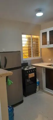 a kitchen with a refrigerator and a stove in it at SDQ Apartamento Marbella 2 in La Ureña
