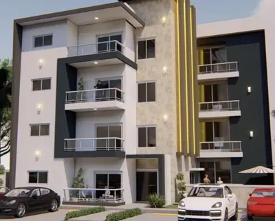 a building with cars parked in front of it at Chelsie 402 in Bayahibe