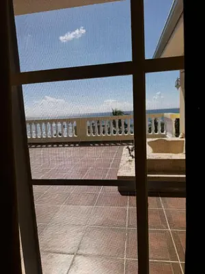 a view from the window of a balcony at Las Palmeras by Graziano in Boca Chica