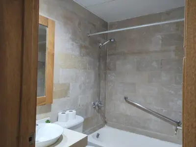 a bathroom with a tub and a sink and a toilet at BeachFront Apartament - Private Beach Access in Punta Cana