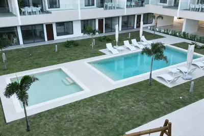 an overhead view of a swimming pool in a building at Tropical Deluxe 2 Bedroom Unit with Picuzzi in Punta Cana