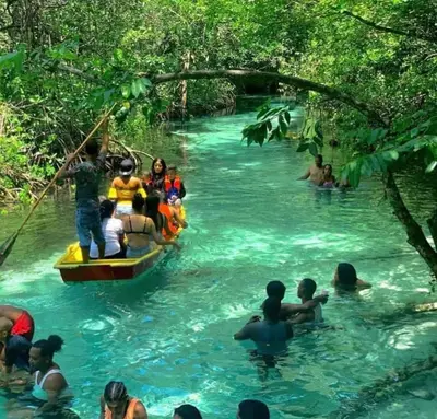 a group of people on a raft in a river at Apartamento Piro 1 - 4 pax - a 5 Min De La Playa in Las Galeras