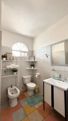 a bathroom with a toilet and a sink at Dominicus Castillo Paradise in La Laguna