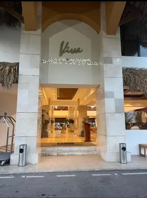 a store front of a building with a sign on it at Dominicus Castillo Paradise in La Laguna