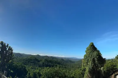 a view of a mountain with trees and a blue sky at Private Getaway - Sosua in Sosúa