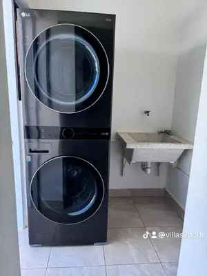 a washer and dryer in a kitchen with a sink at villa green paradise in San Felipe de Puerto Plata