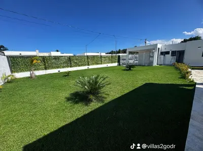 a yard of a house with a fence at villa green paradise in San Felipe de Puerto Plata