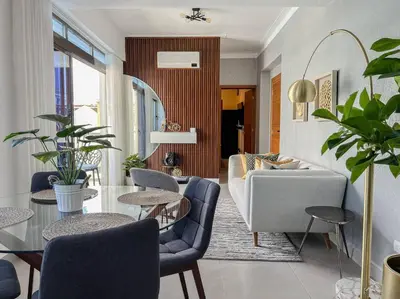 a living room with a couch and a table and chairs at Goistay Elegant Refugio Caribeo 1br Gym Pool Naco in Santo Domingo
