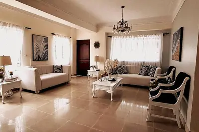 a living room with a couch and a table at Goistay Descubre el Encanto nico de Repblica Dominicana Bella Vista in Los Prados