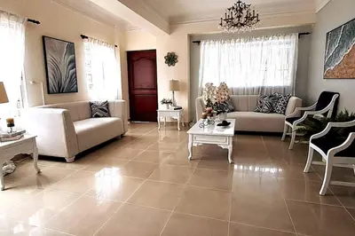 a living room with a couch and a table at Goistay Descubre el Encanto nico de Repblica Dominicana Bella Vista in Los Prados