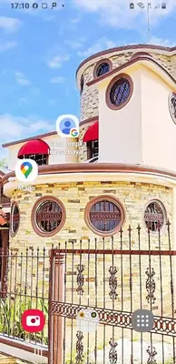 a building with a gate in front of it at Villa lujosa con piscina bayaguana in Bayaguana