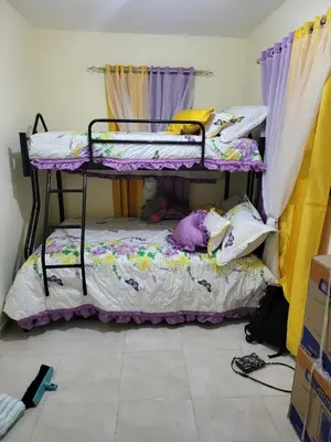 a room with two bunk beds in a room at SUISSE . CH APPARTEMENT in San Pedro de Macorís