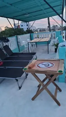 a ping pong table on the roof of a house at SUISSE . CH APPARTEMENT in San Pedro de Macorís